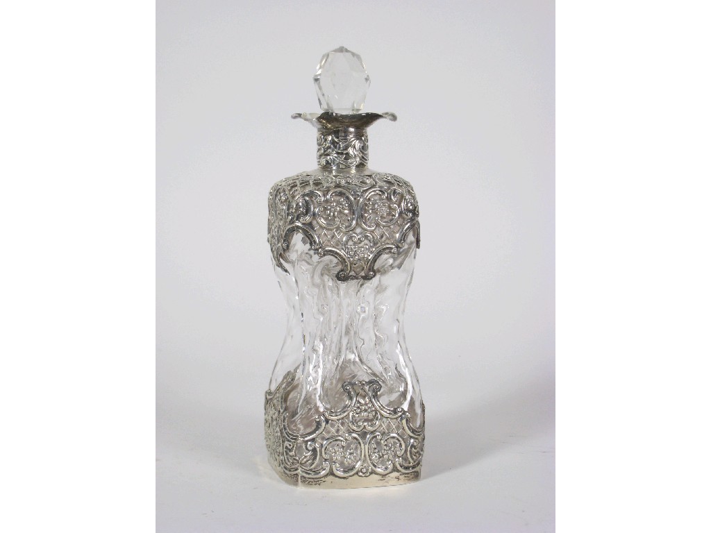 Appraisal: A silver mounted Decanter and Stopper decorated floral scrolls