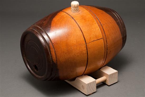 Appraisal: Continental turned walnut cask with carved ivory stopper late th