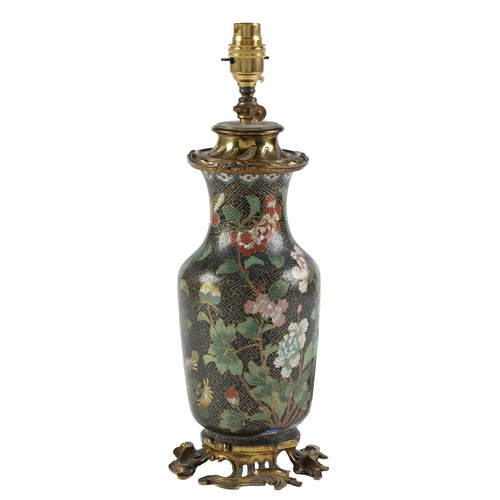 Appraisal: A rococo style lacquered brass oil lamp incorporating a Chinese