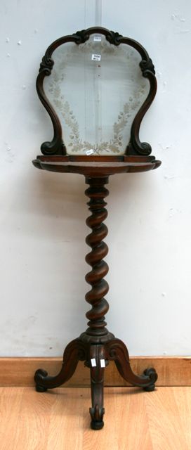 Appraisal: A Victorian walnut occasional table with etched glass panel