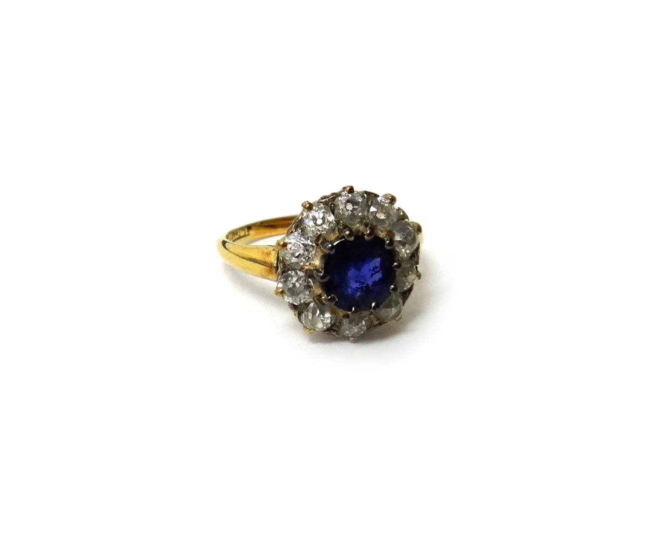 Appraisal: A gold sapphire and diamond set cluster ring claw set