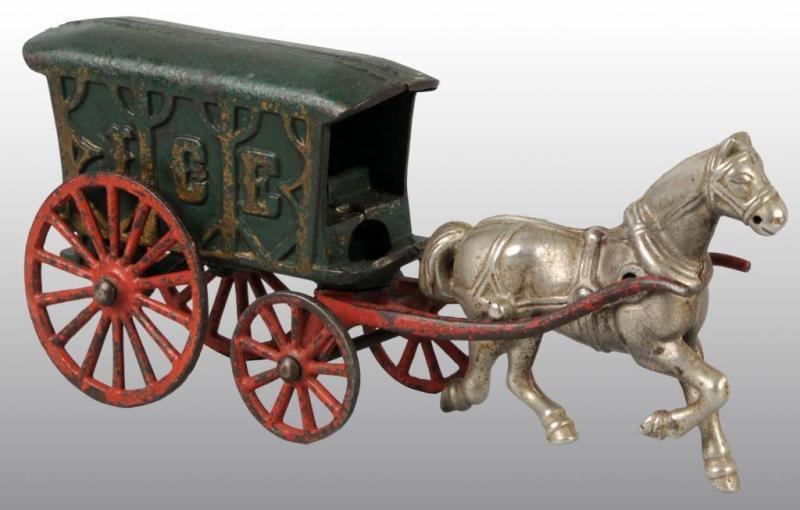 Appraisal: Cast Iron Dent Horse-Drawn Ice Wagon Toy Description Green ice