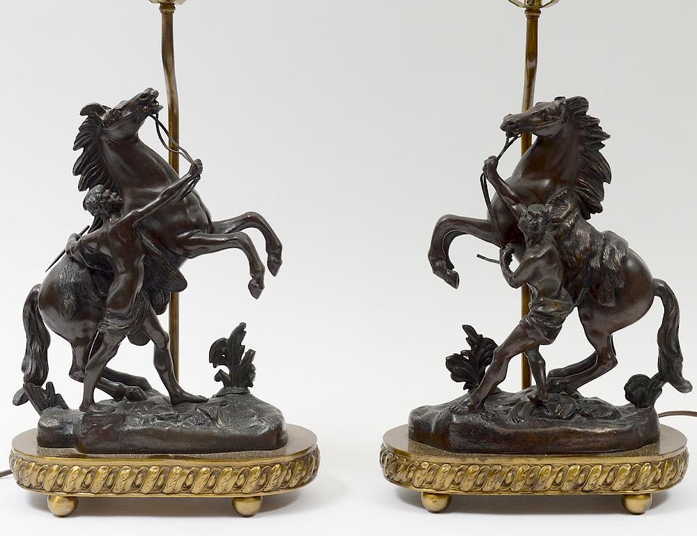 Appraisal: PAIR OF PATINATED WHITE METAL MARLY HORSES LAMPS Each on