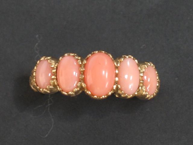 Appraisal: A VICTORIAN CORAL DRESS RING the five oval cabochon graduated