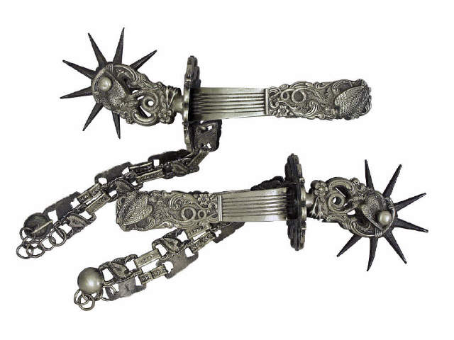 Appraisal: Ornate German silver South American spurs with large rowels Estimate