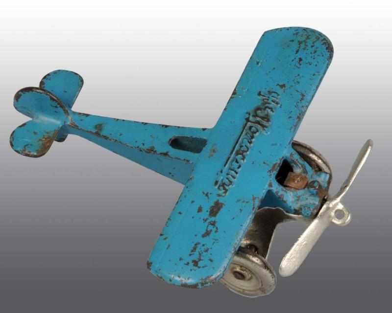 Appraisal: Cast Iron Arcade The Monocoupe Airplane Toy Description American Nickel