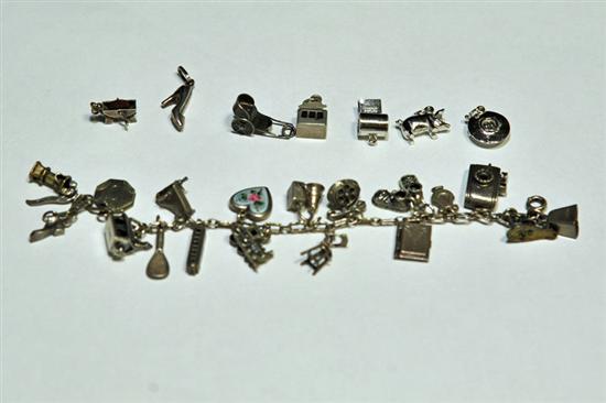 Appraisal: CHARM BRACELET Eighteen charms including a piano church well camera