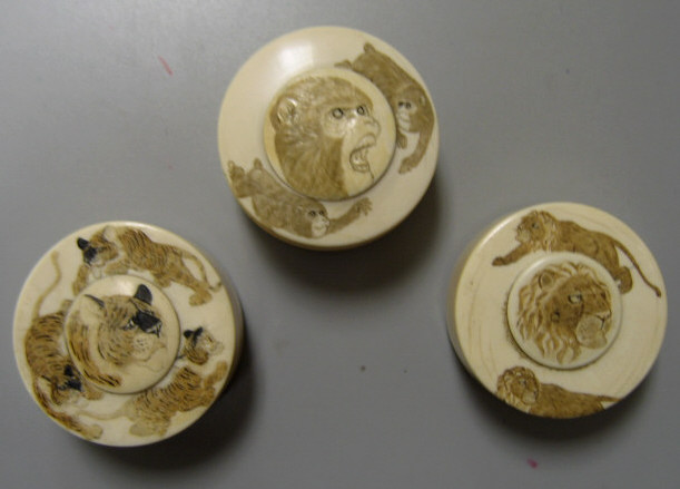 Appraisal: THREE JAPANESE IVORY SNUFF BOXES Meiji period each with stained