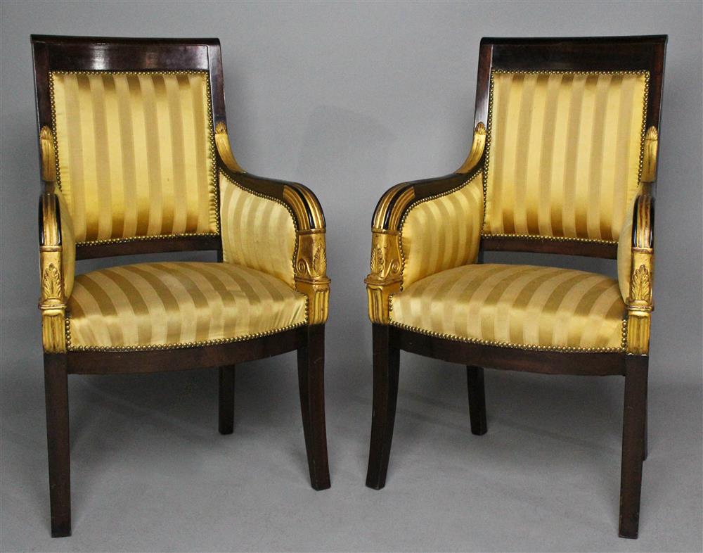 Appraisal: PAIR OF EMPIRE PARCEL GILT MAHOGANY BERGERES upholstered in gold