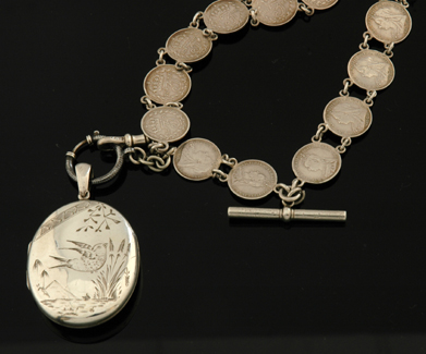 Appraisal: VICTORIAN STERLING SILVER LOCKET SUSPENDED ON A VICTORIAN COIN NECKLACE