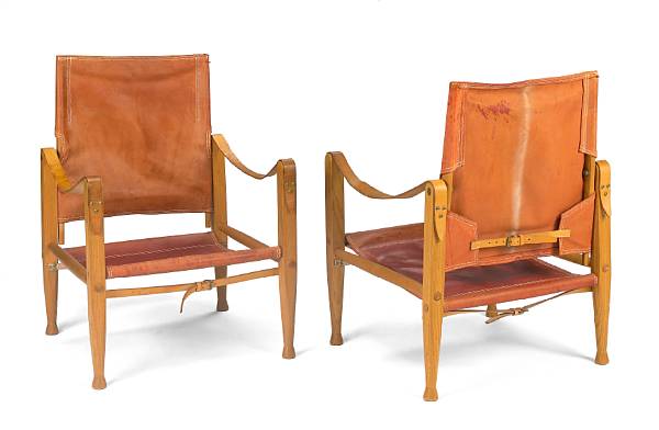 Appraisal: A pair of Kaare Klint leather Safari chairs Denmark s