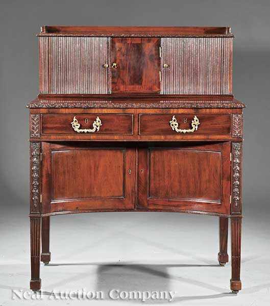 Appraisal: An Antique Georgian-Style Carved Mahogany Tambour Desk mid- th c