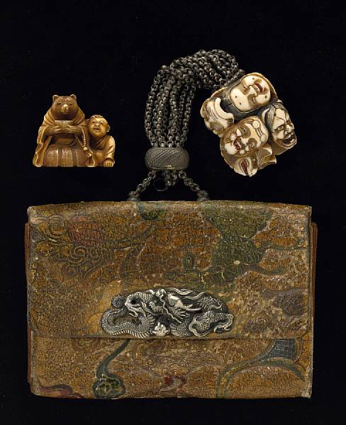 Appraisal: A tobacco pouch and two ivory netsuke Meiji Period The