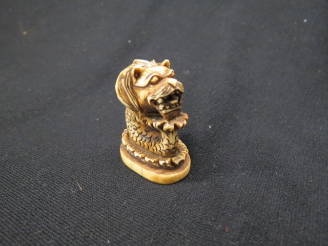 Appraisal: Carved Ivory Netsuke of a Serpent or Dragon signed excellent