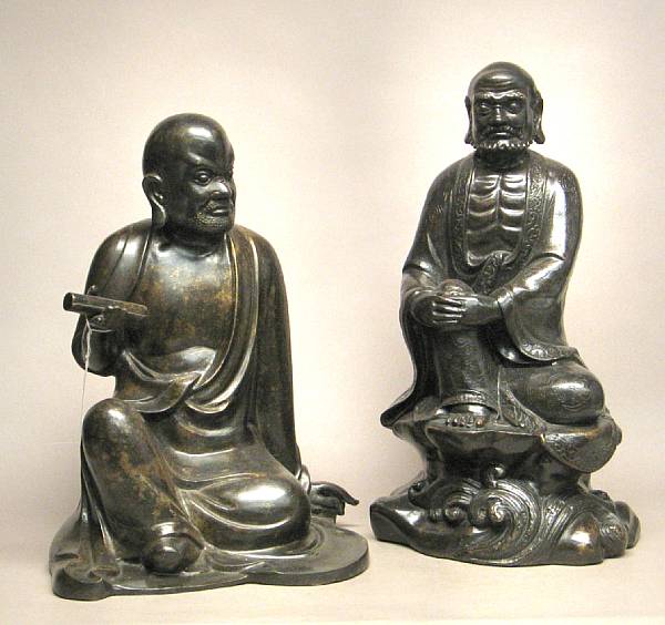 Appraisal: Two Chinese patinated metal figures of seated Buddhist luohan One