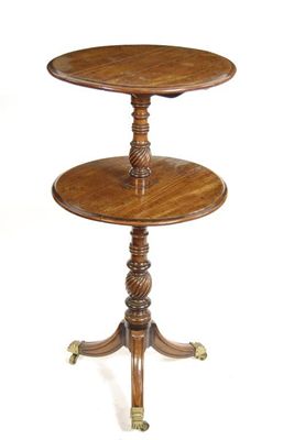 Appraisal: A Regency mahogany dumb waiter with two circular drop leaf