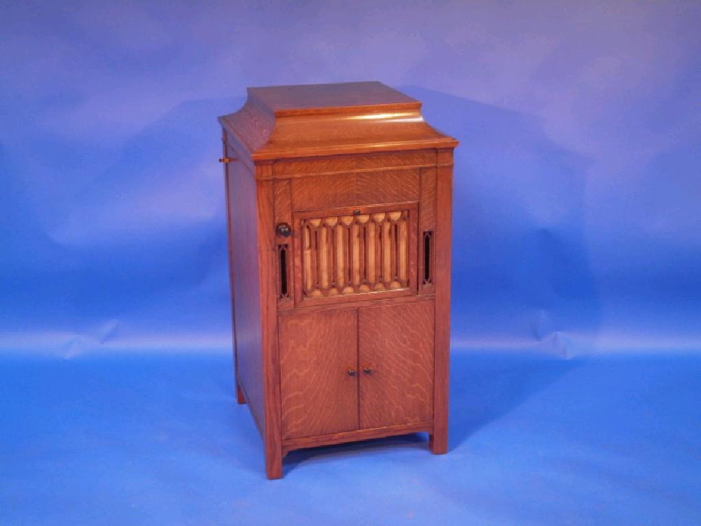 Appraisal: An Aeolian Vocalion oak cased standing wind-up gramophone with hinged