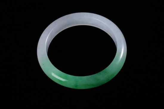 Appraisal: CHINESE APPLE GREEN AND LIGHT GREY JADEITE BANGLE - Inside