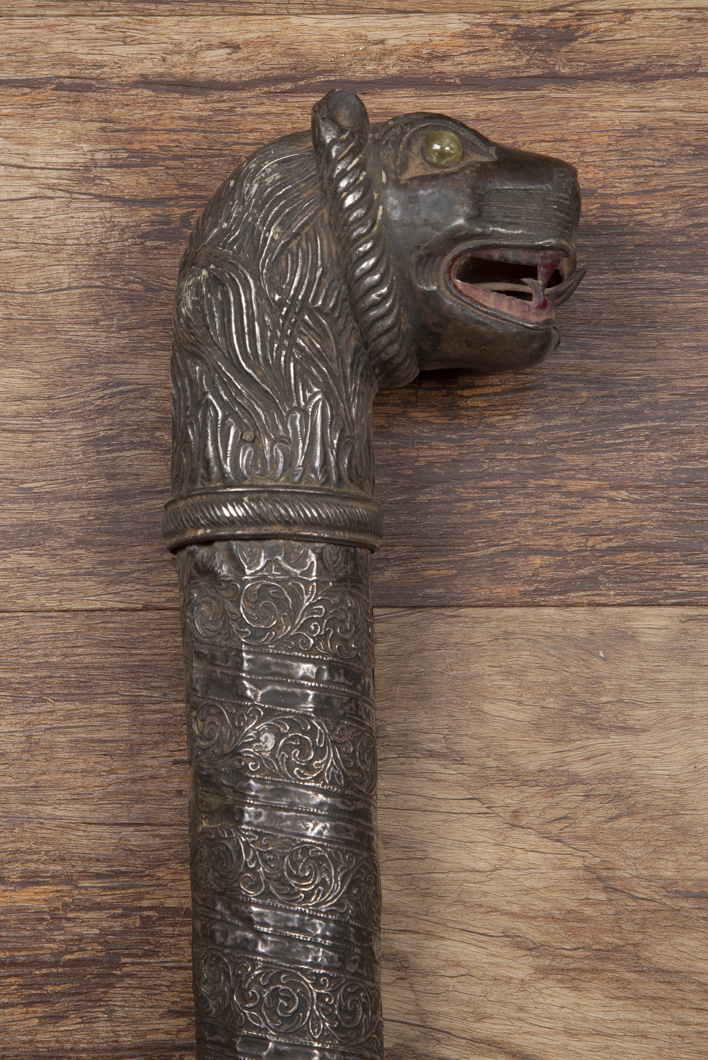 Appraisal: White metal coloured maceIranian with a lion's head handle inlaid