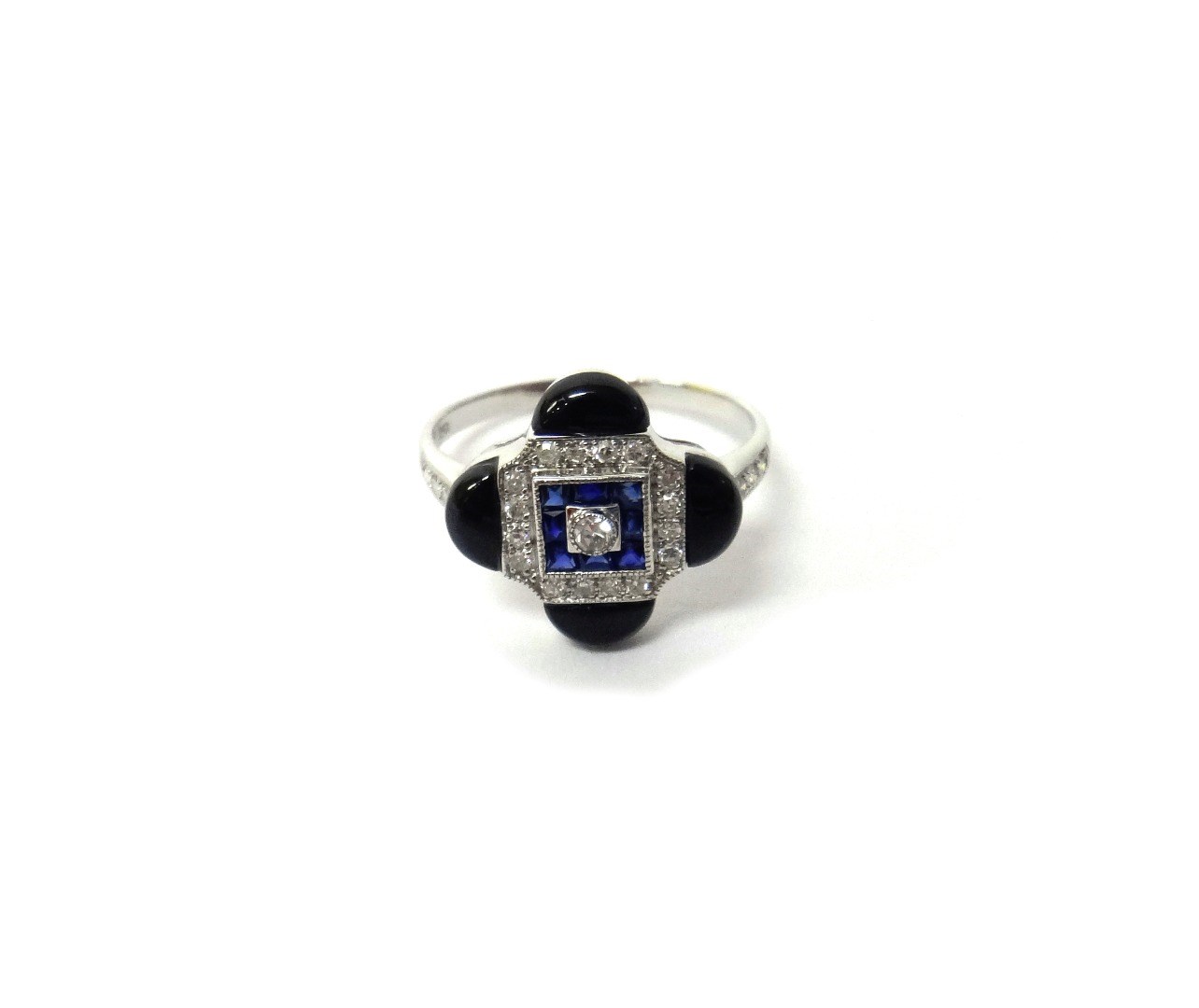 Appraisal: A white gold black onyx diamond and sapphire set ring