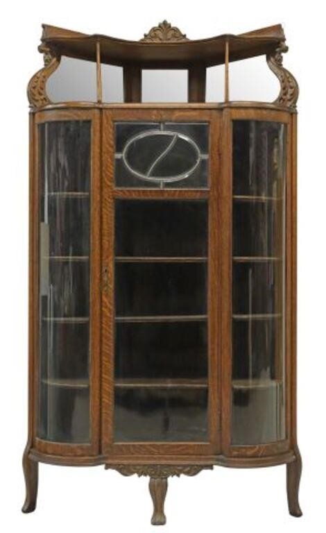 Appraisal: American oak curved glass corner china cabinet Rockford Chair Furniture