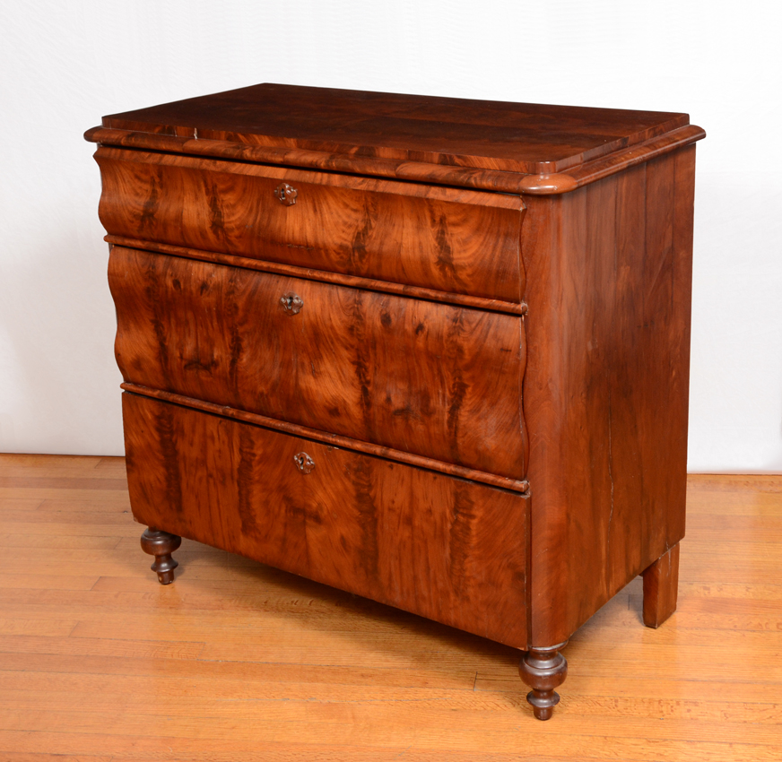 Appraisal: BIEDERMEIER FLAME GRAIN MAHOGANY DRAWER CHEST Richly grained mahogany veneer