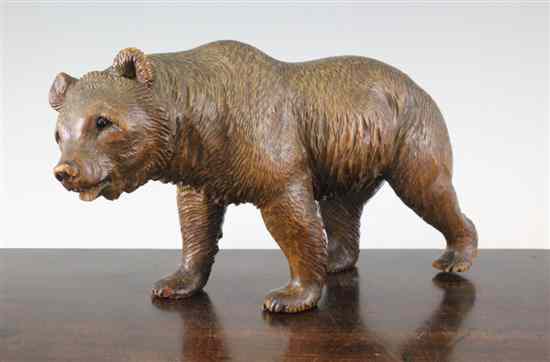 Appraisal: A Black Forest carved wood model of a prowling bear