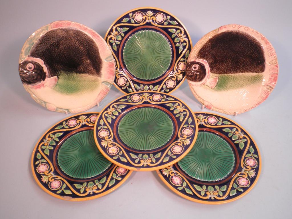 Appraisal: A set of four Majolica side plates each decorated with