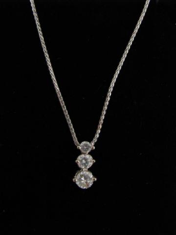 Appraisal: K White gold necklace with three-diamond solitaires set in a