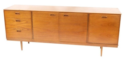 Appraisal: An Avalon Yatton retro teak sideboard with arrangement of three