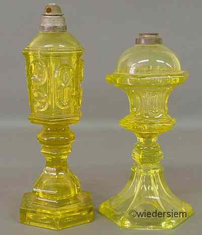 Appraisal: Two similar yellow Sandwich glass fluid lamps th c tallest