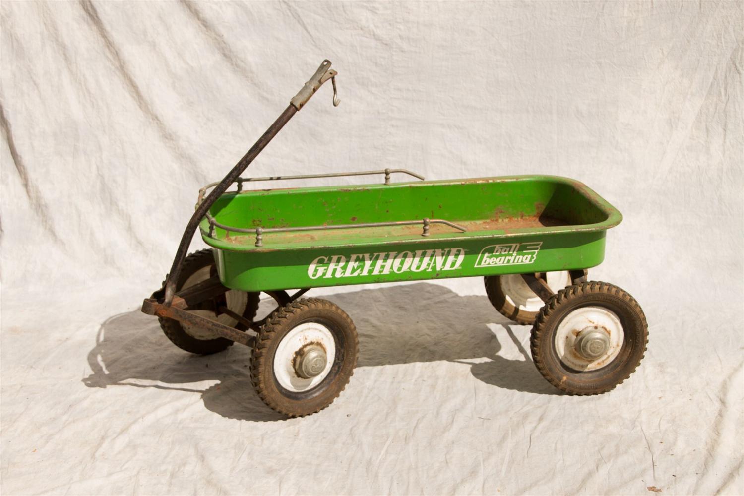 Appraisal: Greyhound pressed steel wagon green with ball bearing track and