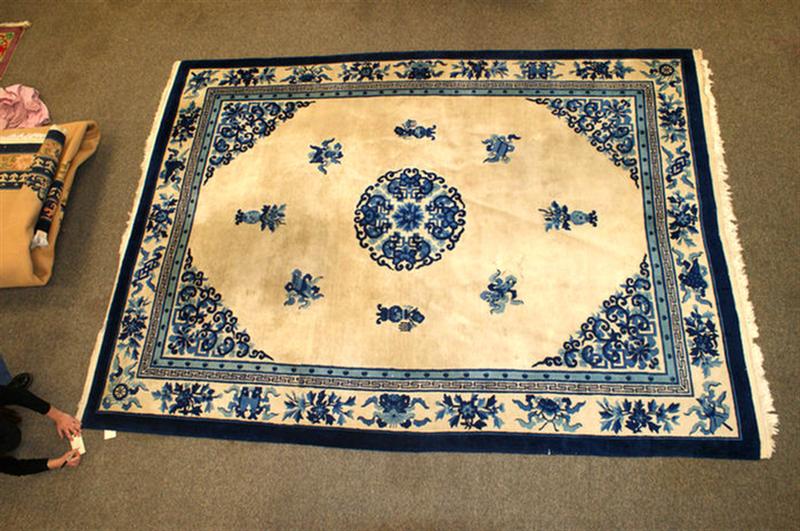 Appraisal: x blue and white sculptured Chinese rug Estimate -