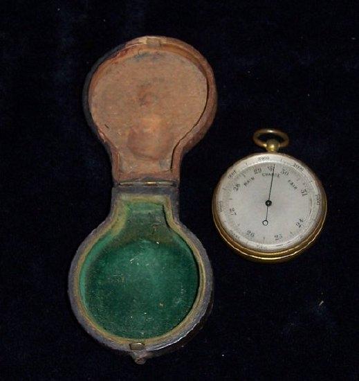 Appraisal: A brass plated pocket barometer in a leather case