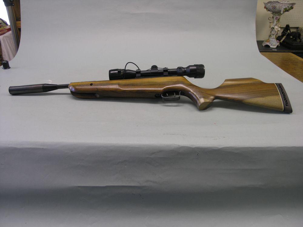 Appraisal: A modern air rifle with walnut stock HE system telescopic