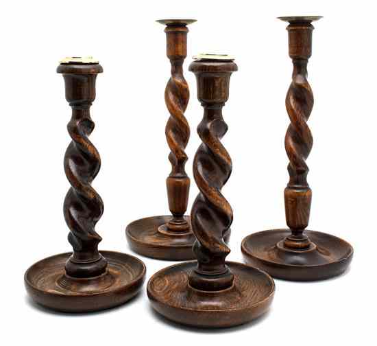 Appraisal: Two Pairs of English Oak Candlesticks each having a barley