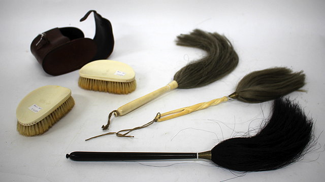 Appraisal: A GROUP OF THREE IVORY AND EBONY FLY WHISKS the