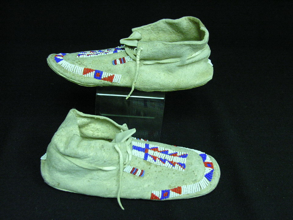 Appraisal: NATIVE AMERICAN BEADED CHILDS MOCCASINS Red white and blue bead