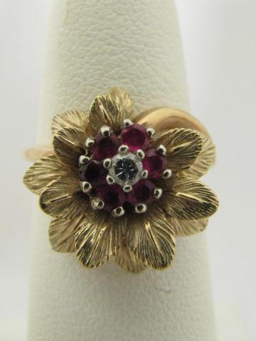 Appraisal: Lady's k yellow gold floral motif ring with rubies and