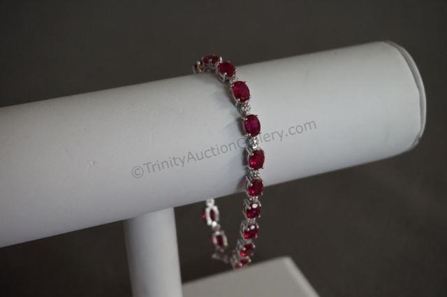 Appraisal: Sterling Silver Tennis Bracelet with Rubies CZ's Red stones appear