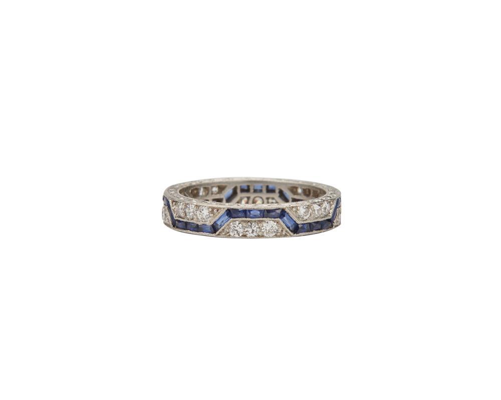 Appraisal: Platinum and Sapphire Band featuring geometrically arranged French-cut sapphires alternating