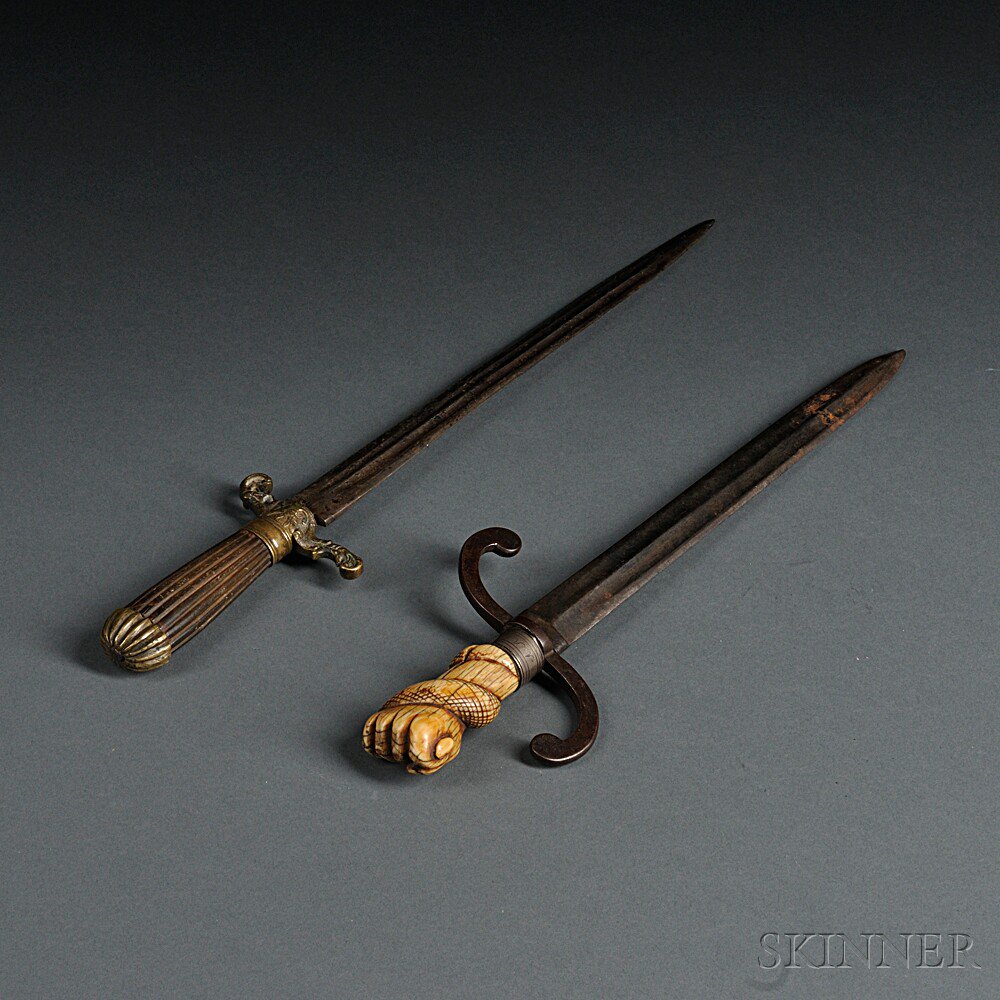 Appraisal: Two Daggers c th century a brass hilt and pommel