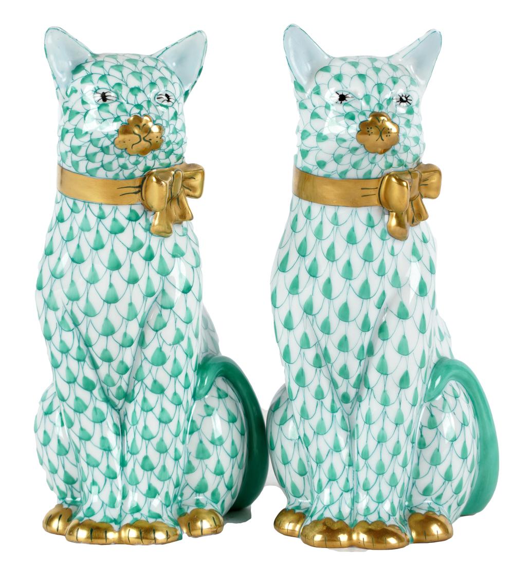 Appraisal: TWO HEREND GREEN FISHNET PORCELAIN CAT FIGURESprinted and painted factory