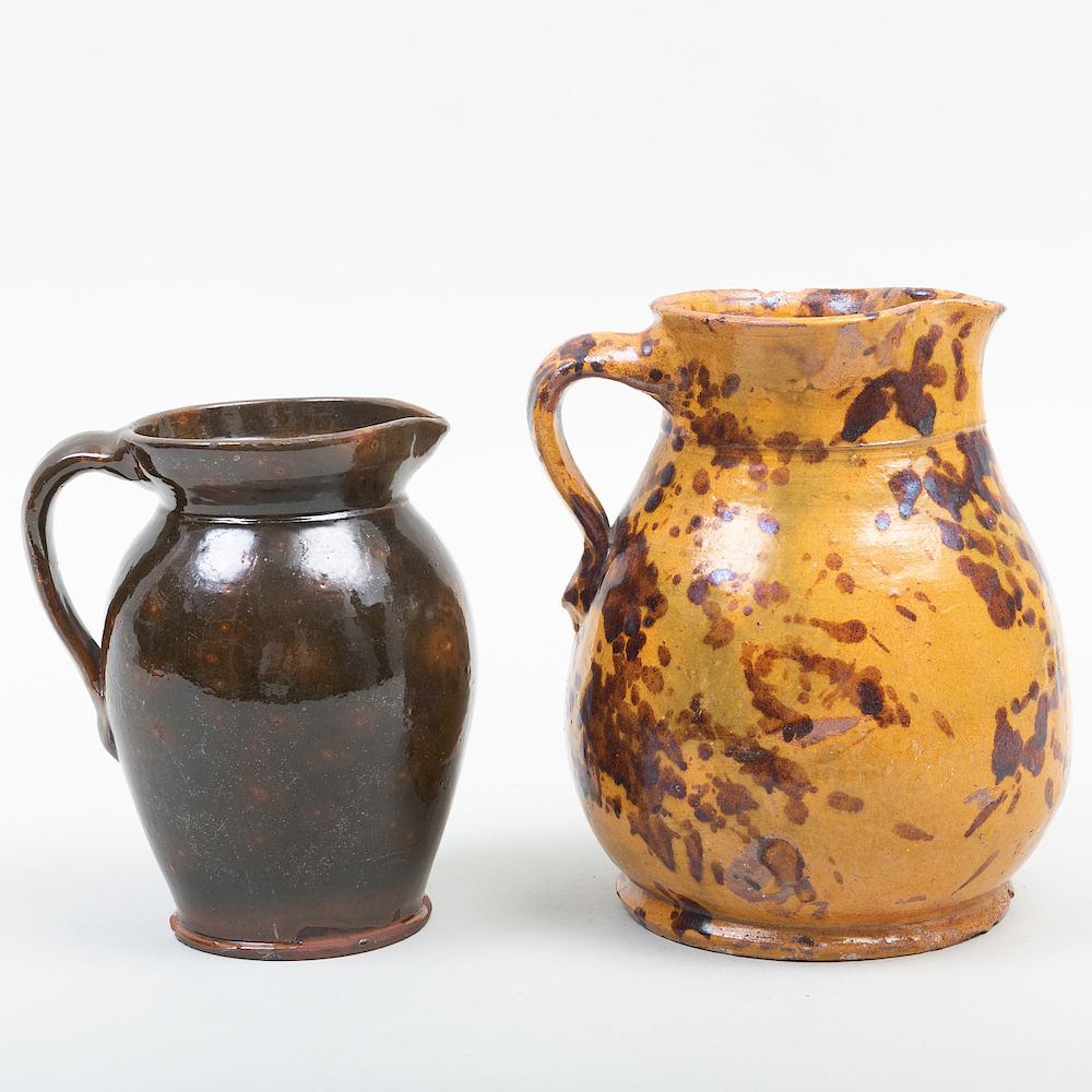 Appraisal: Two American Redware Glazed Pottery Pitchers The larger in high