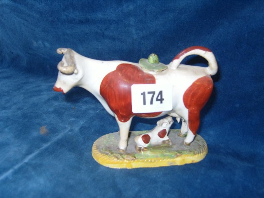 Appraisal: A th century cow creamer the cow with red painted