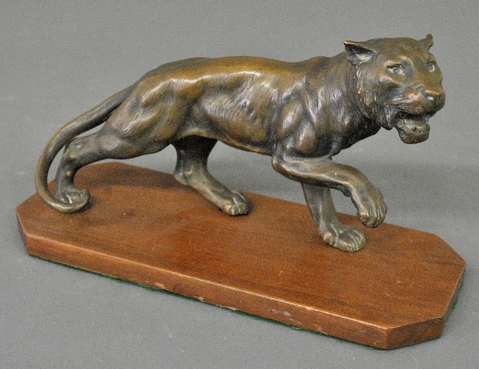 Appraisal: - Bronze of a tiger mounted on a walnut base