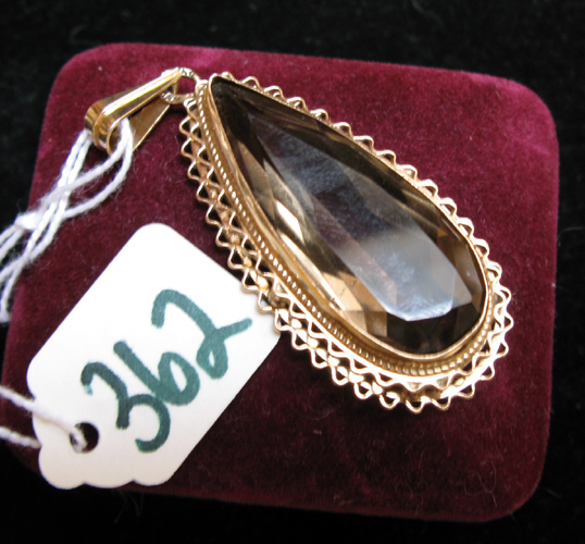 Appraisal: SMOKY QUARTZ AND FOURTEEN KARAT GOLD PENDANT The - inch