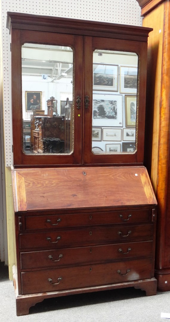 Appraisal: An th century mahogany bureau bookcase with pair of mirrored