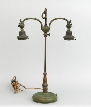 Appraisal: A Tiffany Lamp Base A bronze student's double table lamp