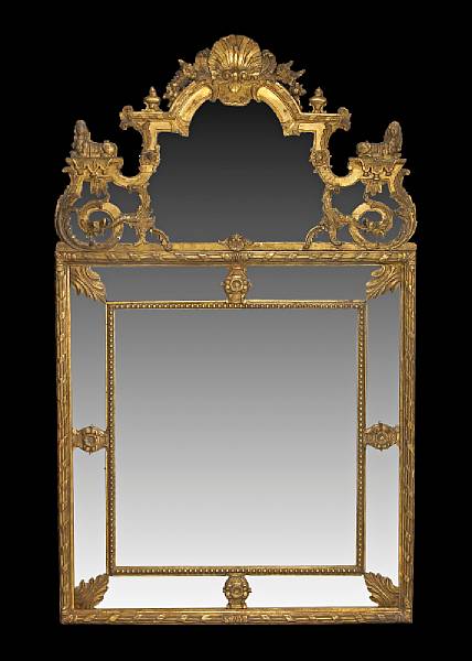 Appraisal: A Continental Baroque style giltwood mirror crest early th century